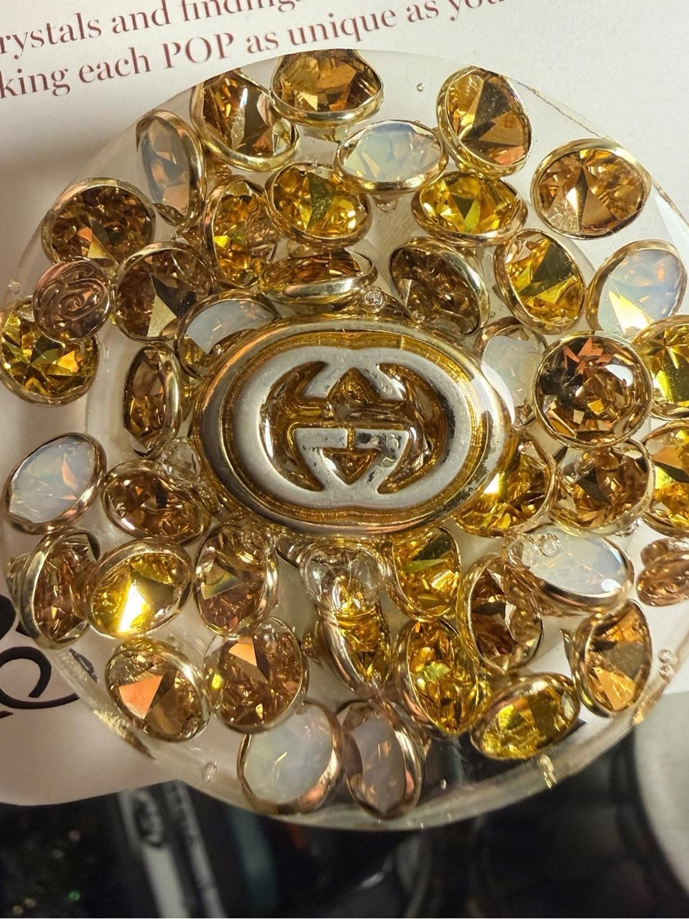 Pop-Socket made by Spark*l bands with upcycled Gucci hardware/Swarovski crystals